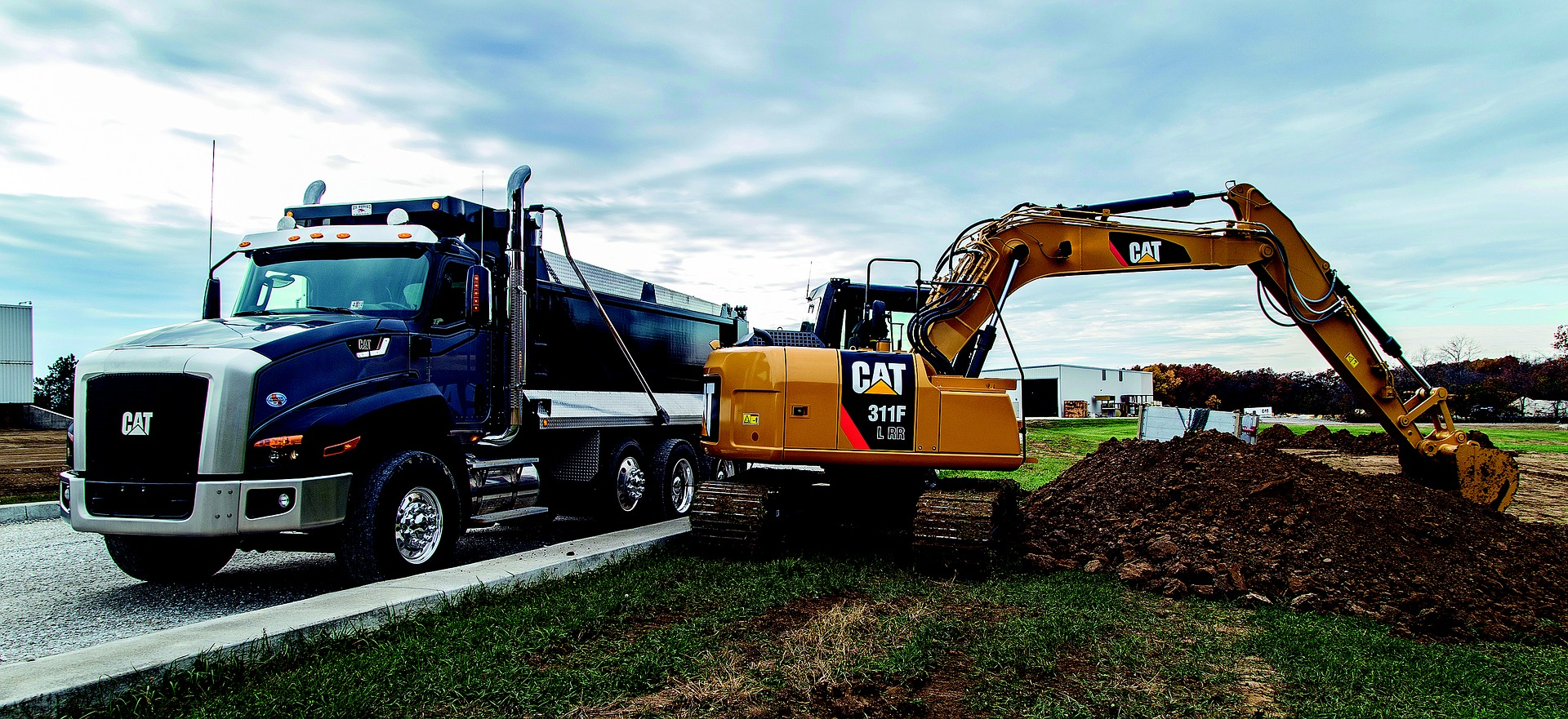 Construction equipment works on the side of a highway in Victoria, BC