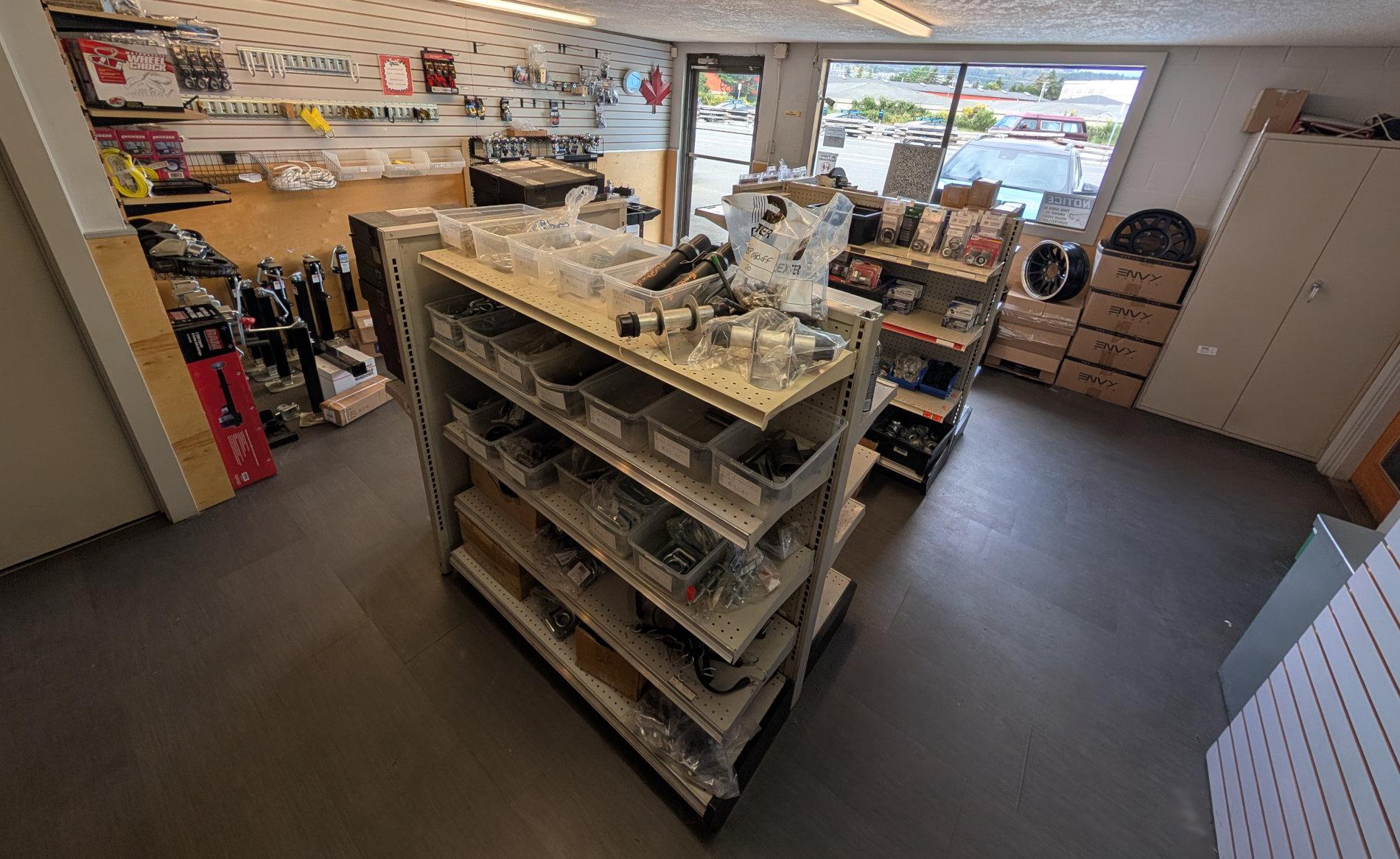 Thomcat Equipment Trailer Parts Shop front entryway and interior store.