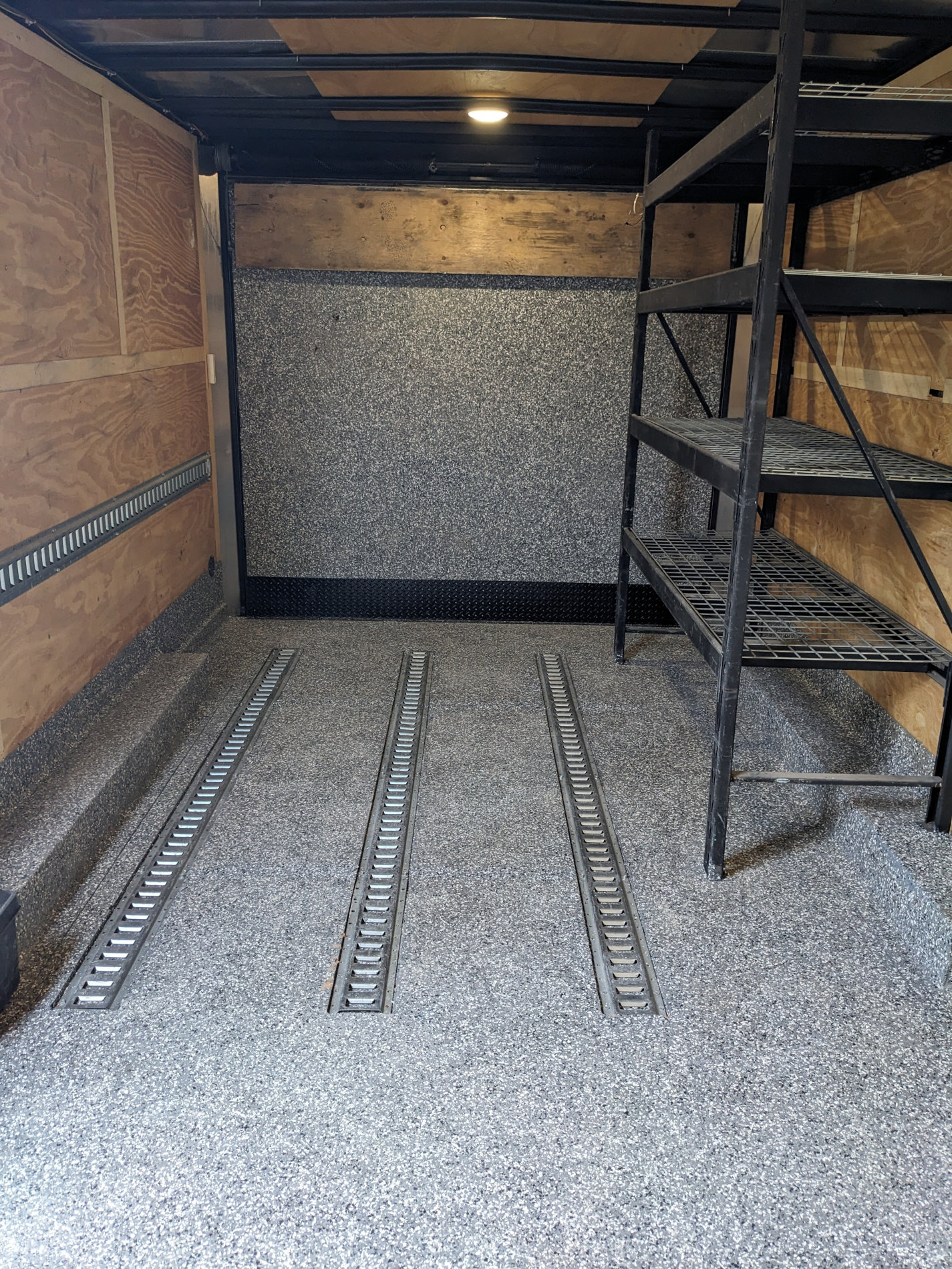 trailer-racks-and-etrack-installation-thomcat Upgraded interior of a cargo trailer with E-Track installed and custom shelving. Trailer servicing and repair by Thomcat Equipment in Victoria